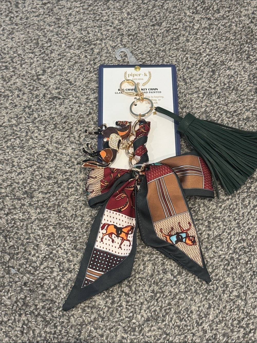 Bag charm & key chain, painted horse pendant, a ribbon bow, and a green tassel